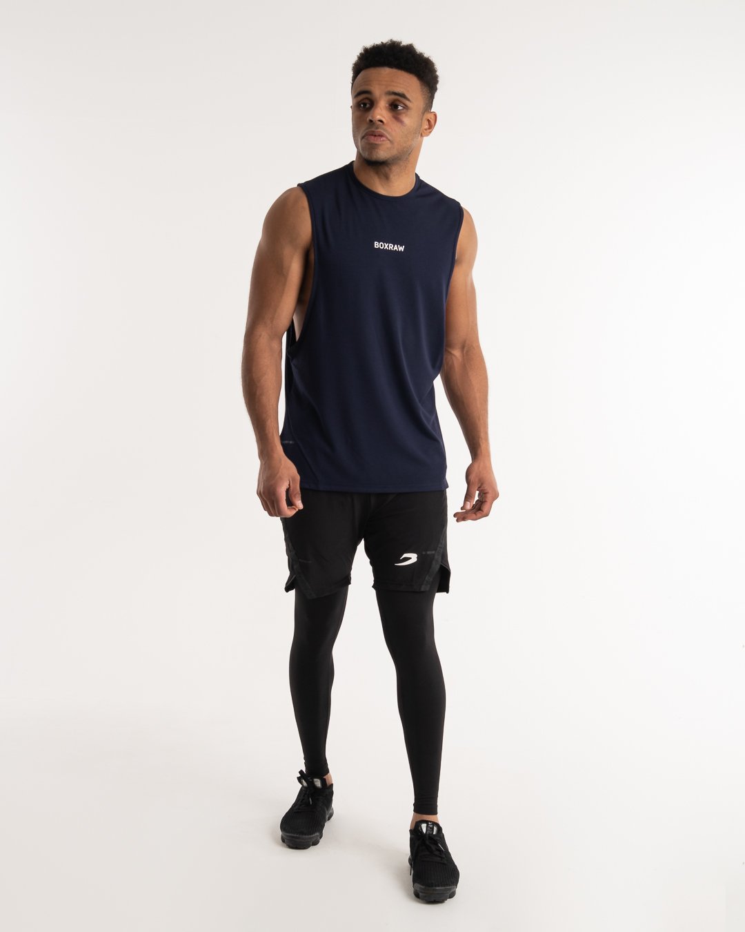 man wearing navy dark grey boxraw performance muscle fit tank top