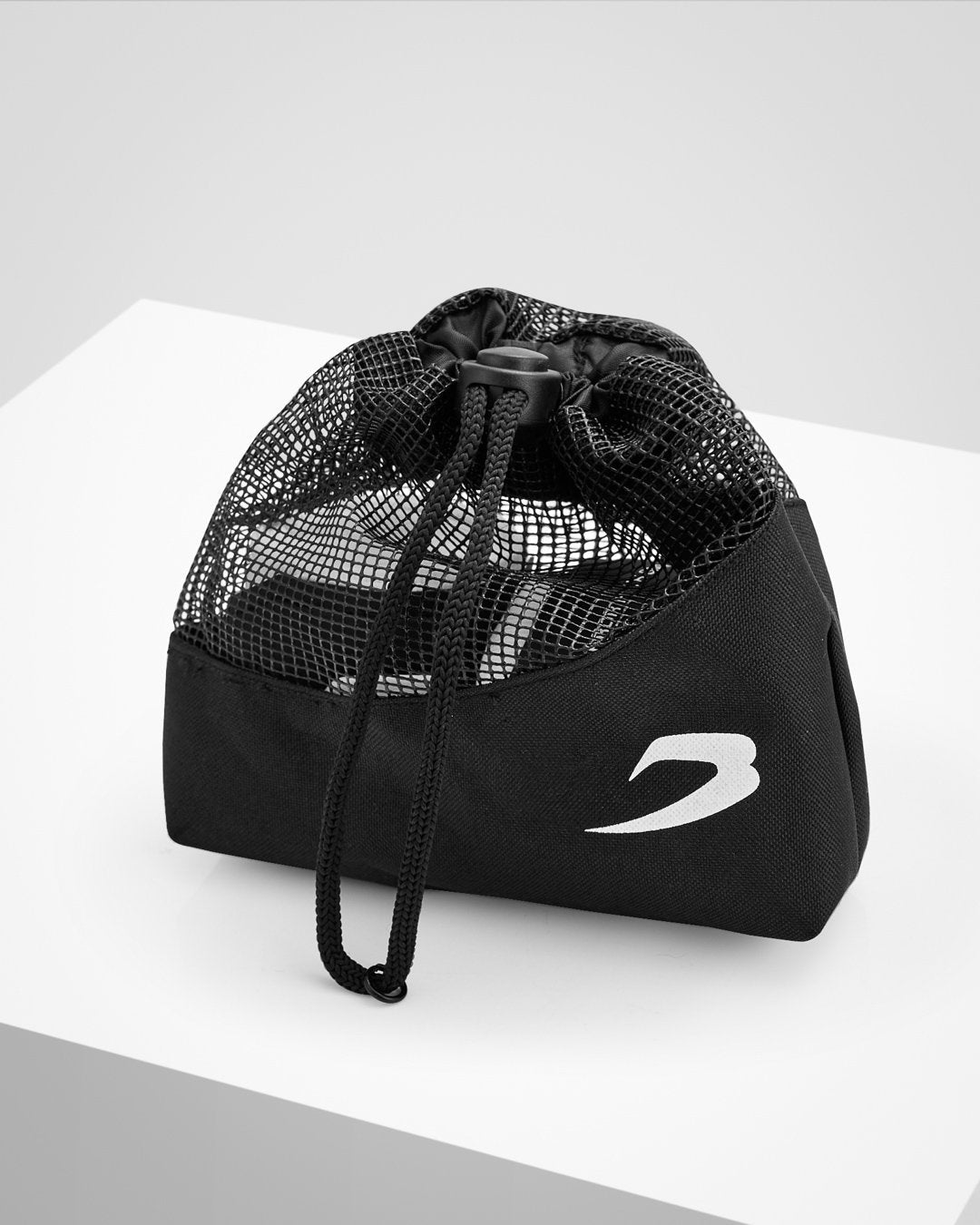 White fabric boxing handwraps that is 4.5 metres in length with a leather velcro strap embossed with a white boxraw strike logo.