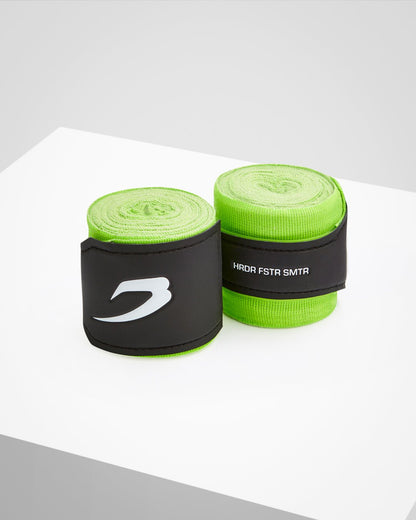 Neon green fabric boxing handwraps that is 4.5 metres in length with a leather velcro strap embossed with a white strike logo.