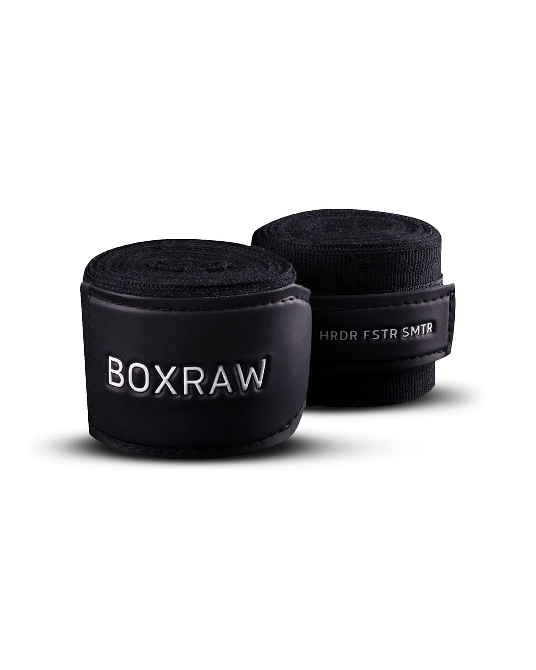 Black fabric boxing handwraps that is 3.5 metres in length with a leather velcro strap embossed with a white boxraw strike logo.