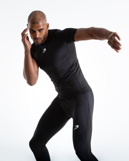 Man in black compression long sleeved t-shirt made from mesh fabric and targeted ventilation panels with white boxraw strike logo on the chest.