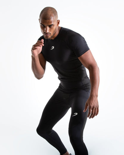 Man in black compression long sleeved t-shirt made from mesh fabric and targeted ventilation panels with white boxraw strike logo on the chest.
