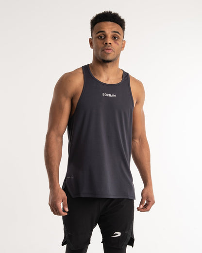man wearing charcoal dark grey boxraw performance stringer tank top