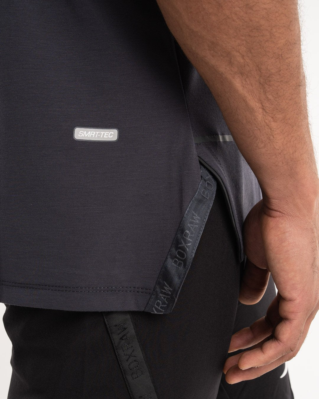man wearing charcoal dark grey boxraw performance stringer tank top