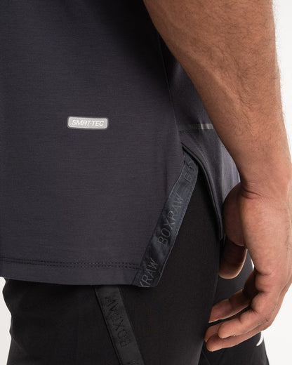 man wearing charcoal dark grey boxraw performance stringer tank top