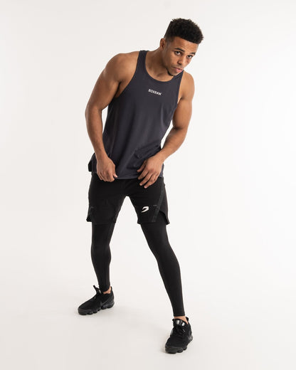man wearing charcoal dark grey boxraw performance stringer tank top