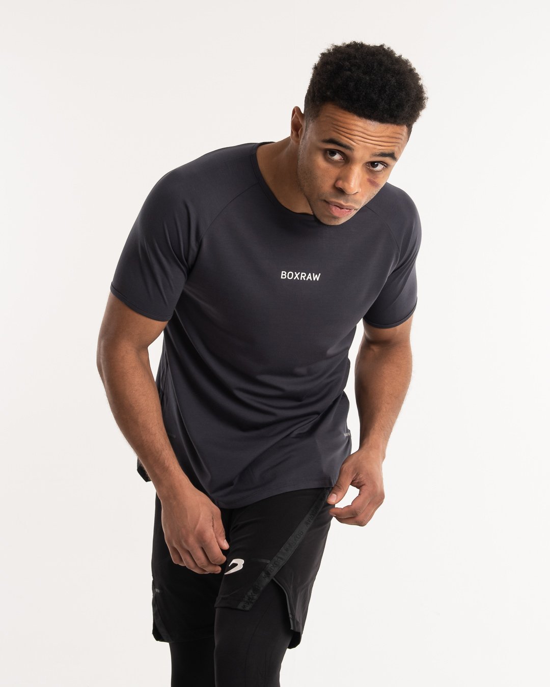 man wearing charcoal dark grey boxraw performance t-shirt tank top