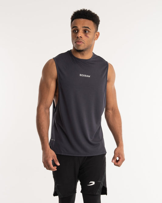 man wearing charcoal dark grey boxraw performance muscle fit tank top
