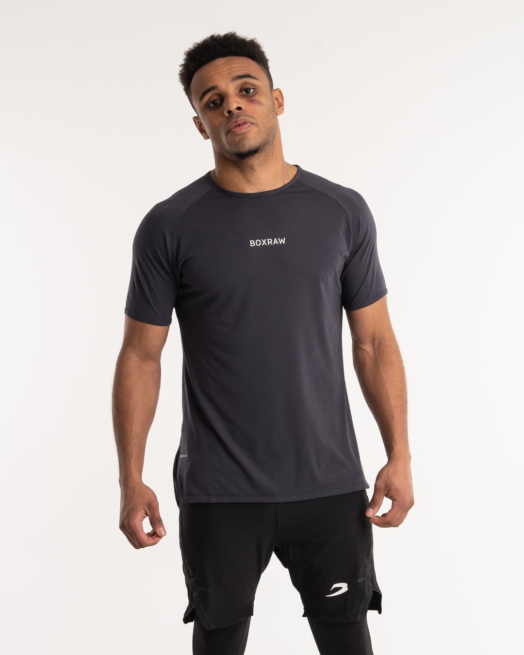man wearing charcoal dark grey boxraw performance t-shirt tank top