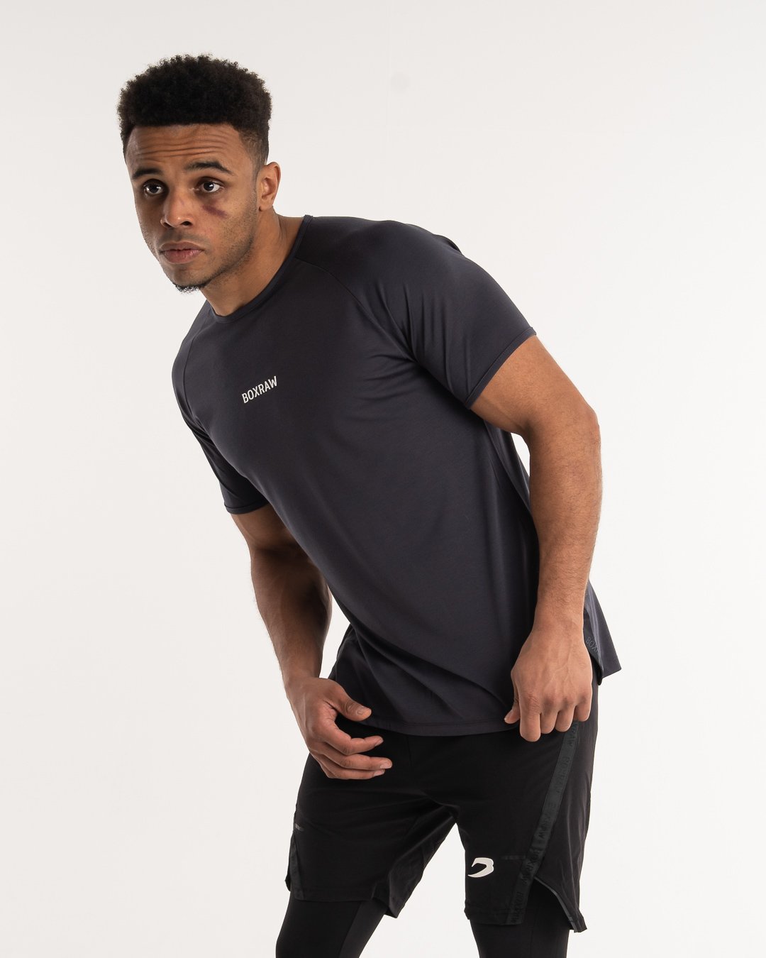 man wearing charcoal dark grey boxraw performance t-shirt tank top