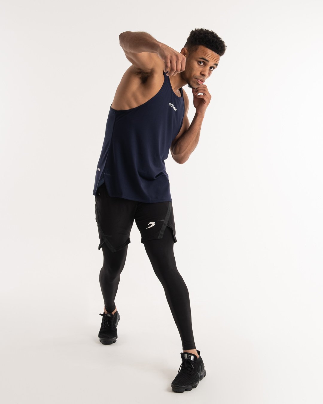 man wearing navy dark grey boxraw performance stringer tank top