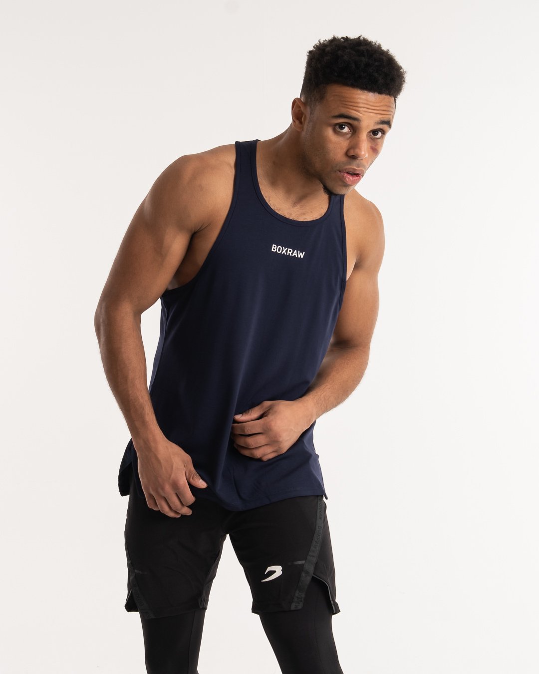 man wearing navy dark grey boxraw performance stringer tank top
