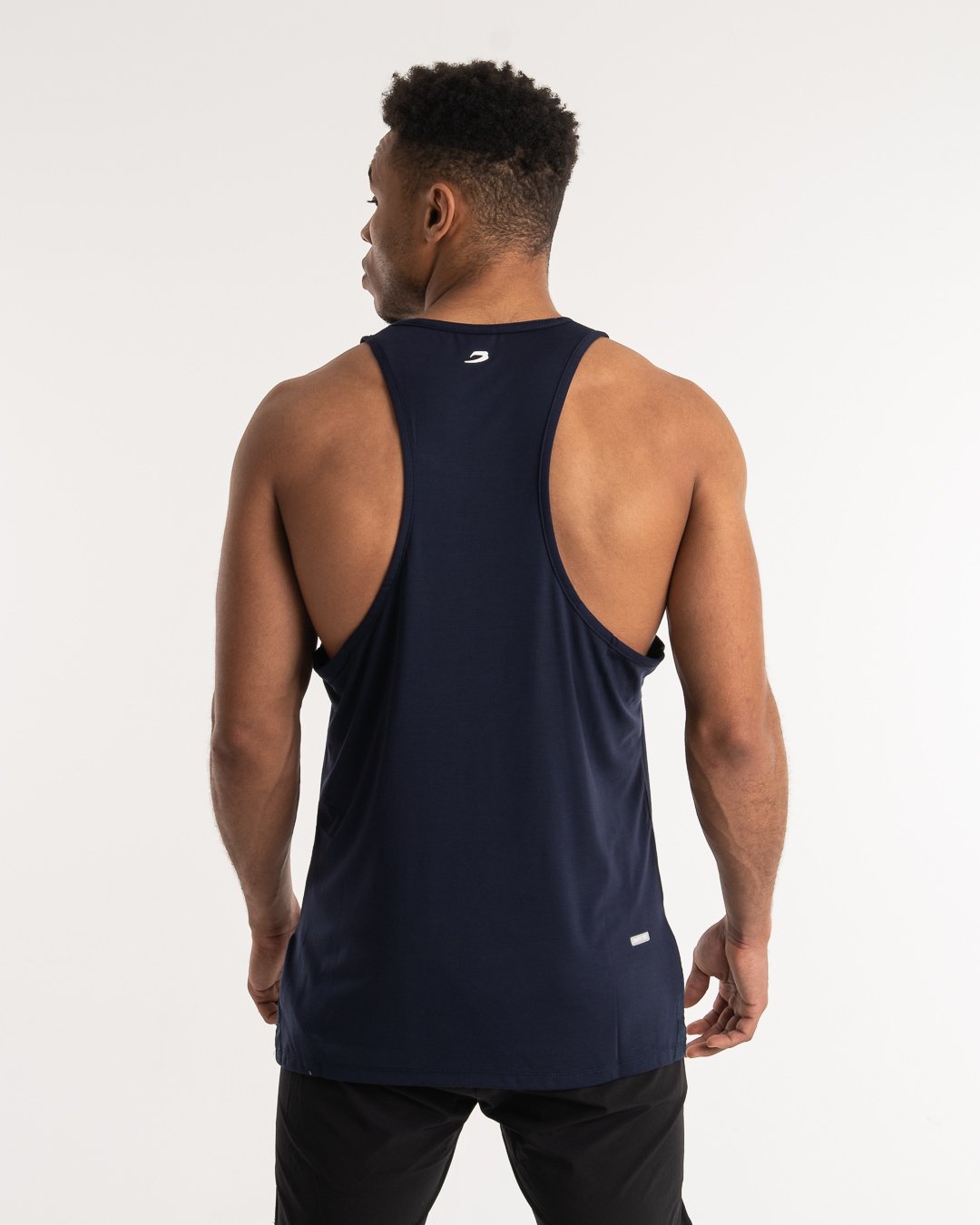man wearing navy dark grey boxraw performance stringer tank top