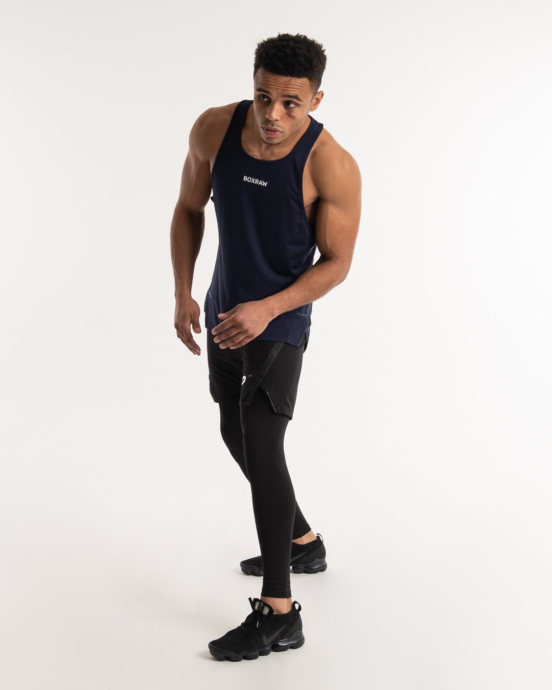 man wearing navy dark grey boxraw performance stringer tank top