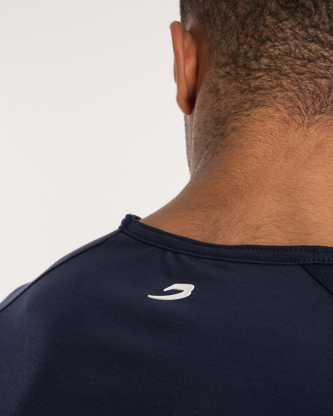 man wearing navy dark grey boxraw performance t-shirt tank top
