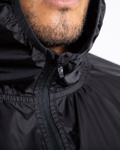 Man in black zipped windbreaker with hood and reflective big boxraw strike logo across left body panel made from nylon.