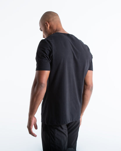 Man in black slim fit cotton t-shirt with we dont play boxing text in white on chest.
