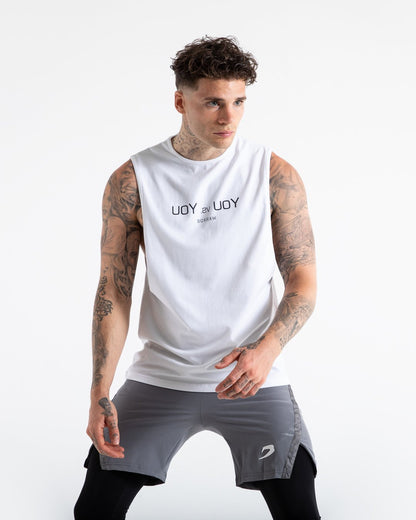 Man in white slim fit cotton muscle tank with reversed you vs you text in black on chest.