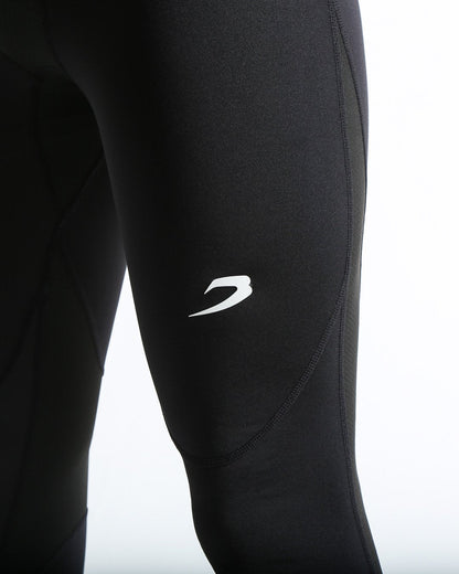 Man in black compression leggings/tights with wide elastic waistband and a white 3D strike logo on the leg.